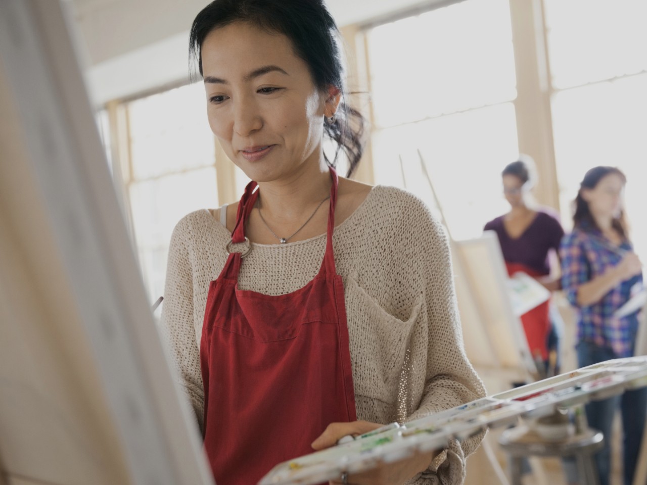 Woman in art class painting